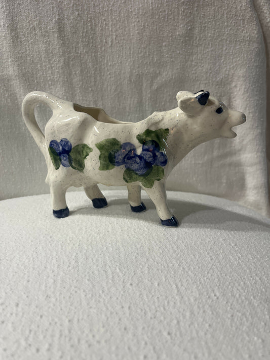 Ceramic cow creamer with blueberry fruit